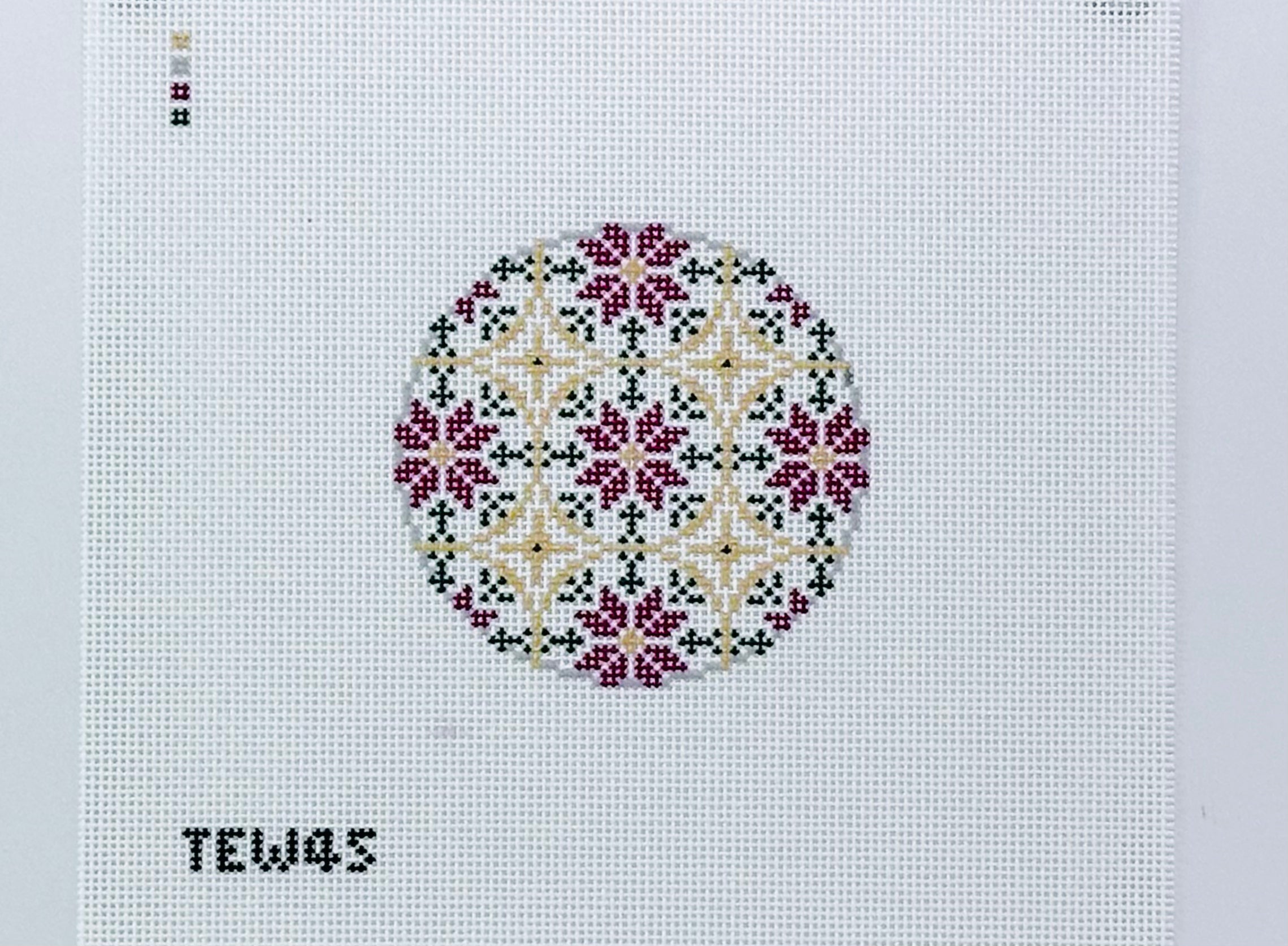 Poinsettia Pattern Ornament with Red, Green, and Gold, signed TEW45